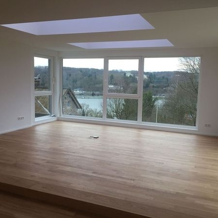 Verlegung von Laminat im Wohnzimmer in Essen-Kupferdreh ausgeführt von Malerbetrieb Overdreef